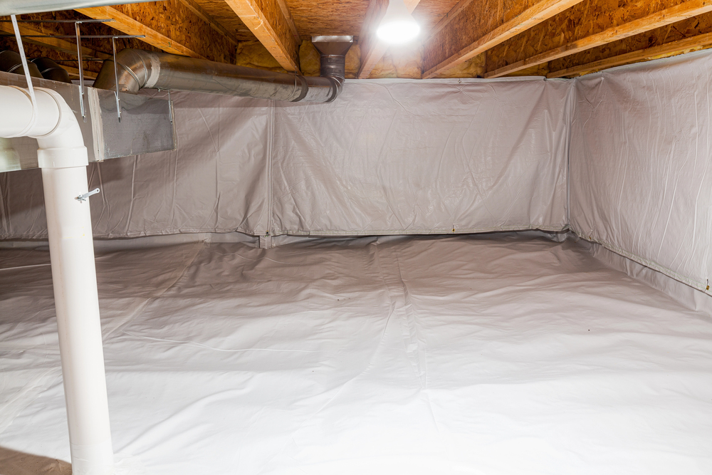 A crawl space with exposed ceiling beams, HVAC ductwork, and white plastic vapor barrier lining the floor and walls.